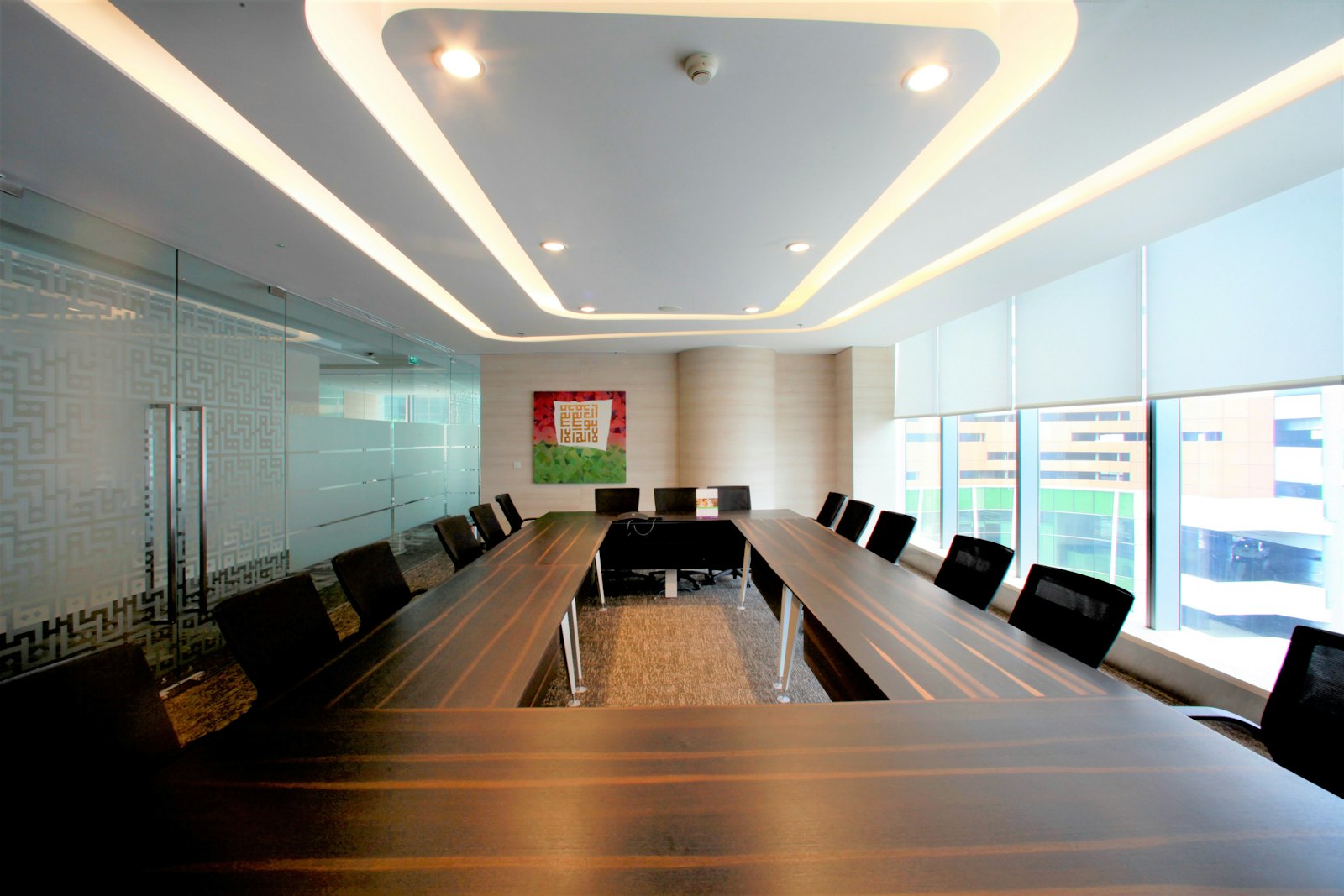 A meeting room with floor-to-ceiling windows